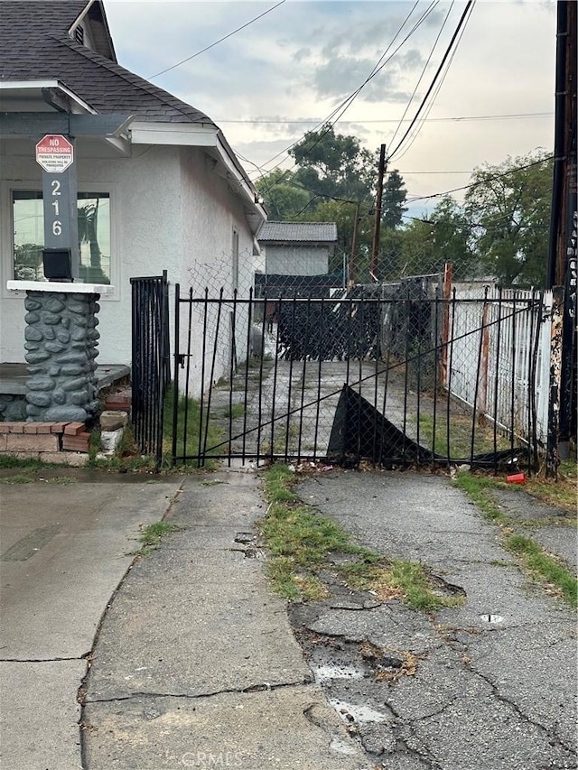 view of gate with fence