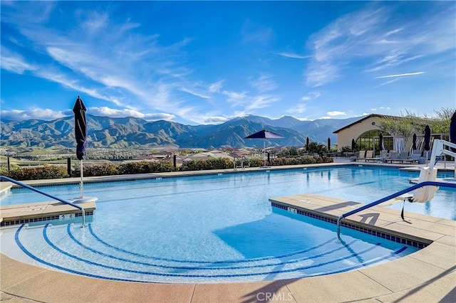 view of pool with a mountain view