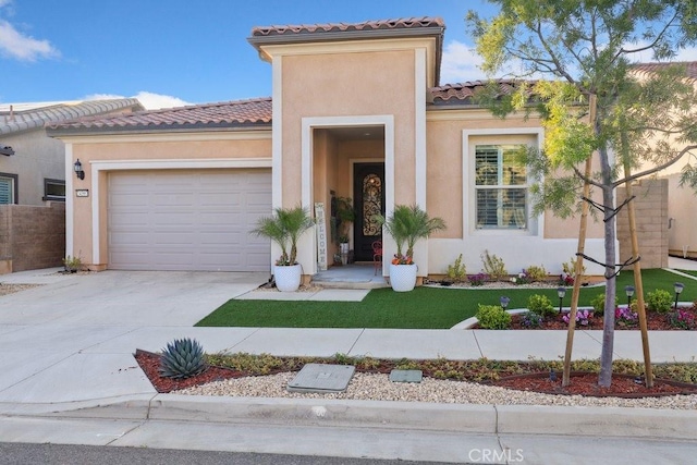 mediterranean / spanish-style home with a garage