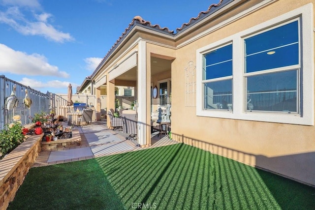 exterior space with a yard and a patio