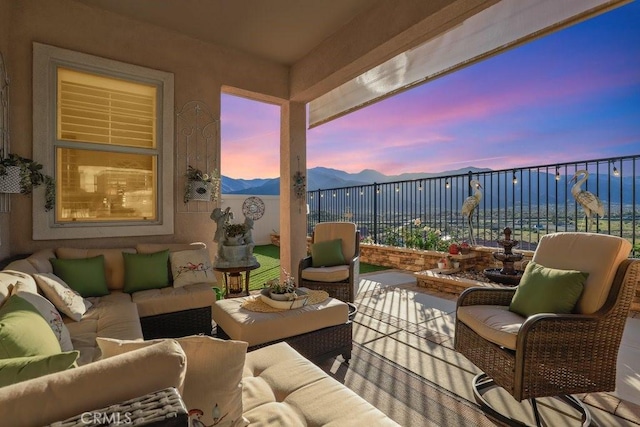 exterior space with an outdoor living space and a mountain view