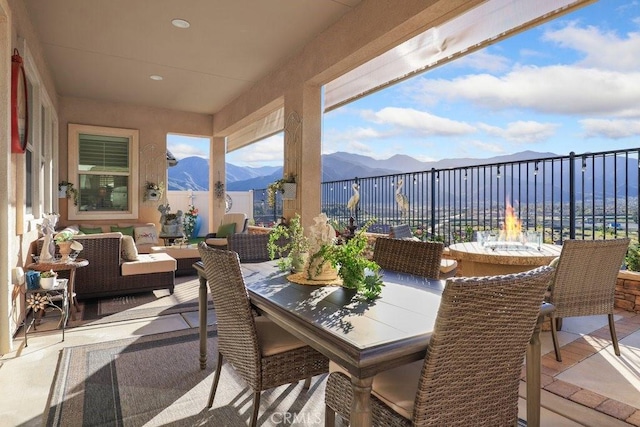 view of patio with a mountain view and an outdoor hangout area