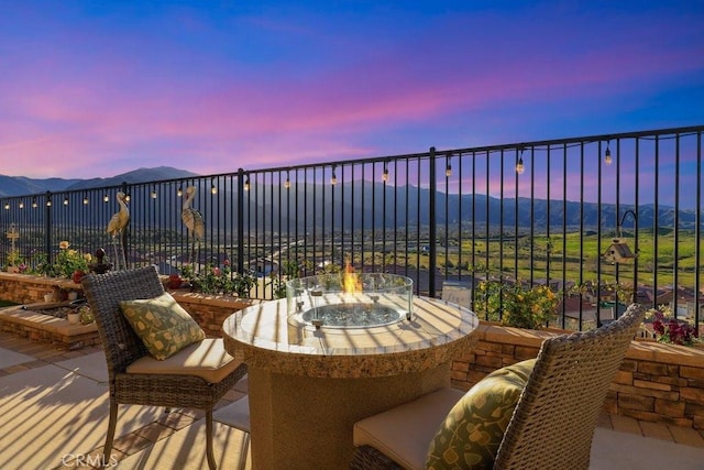 patio terrace at dusk with a mountain view