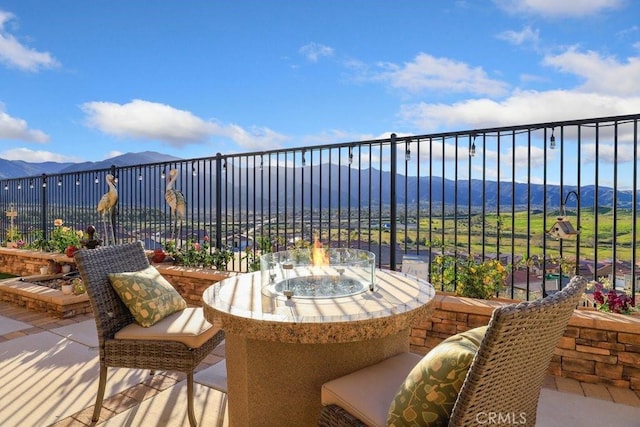 view of patio / terrace featuring a mountain view