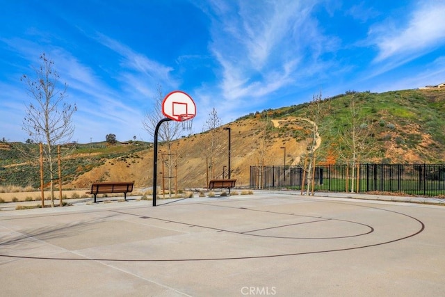 view of basketball court featuring a mountain view