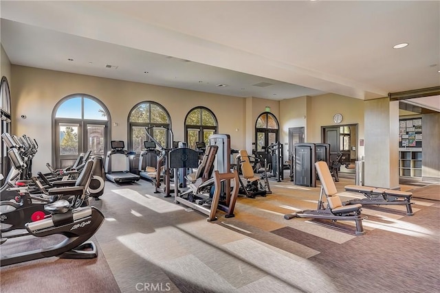 exercise room with light carpet