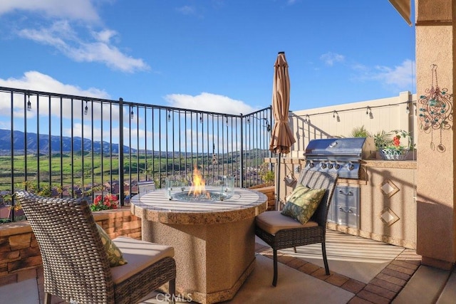 view of patio with exterior kitchen and grilling area