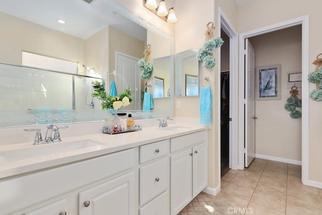 bathroom with tile patterned flooring and vanity