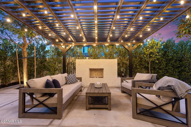 patio terrace at dusk featuring an outdoor living space and a pergola