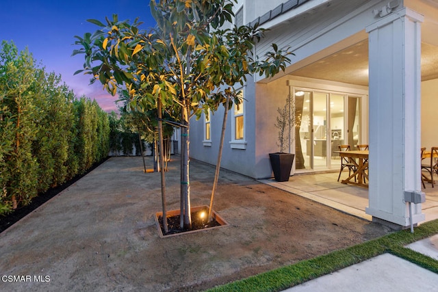 view of patio terrace at dusk