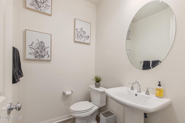 bathroom featuring sink and toilet