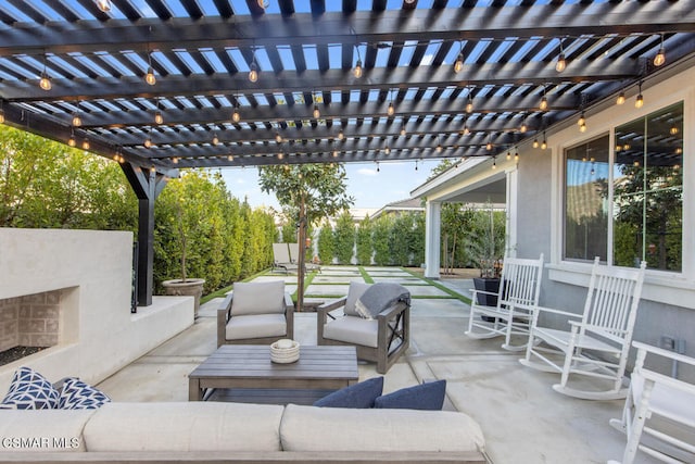 view of patio with outdoor lounge area and a pergola