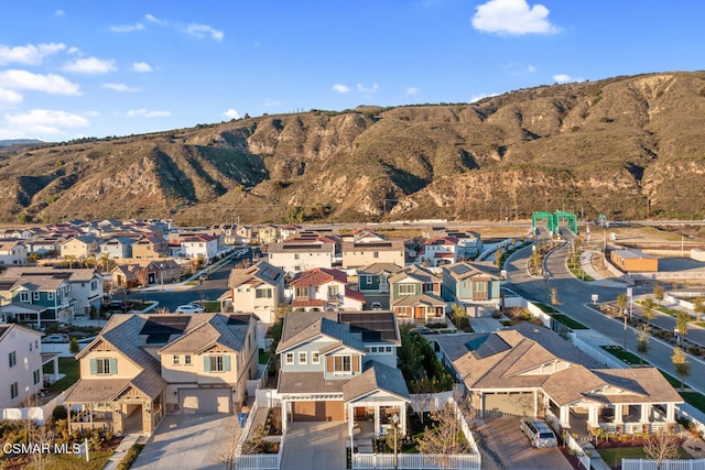 birds eye view of property with a mountain view