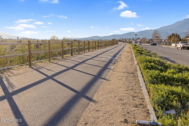 view of street with a mountain view and a rural view