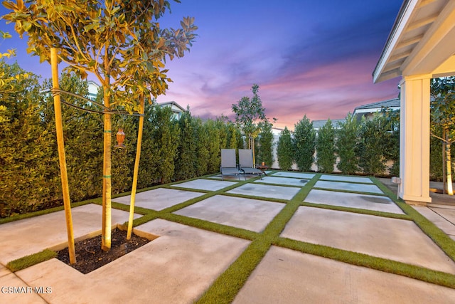 view of patio terrace at dusk