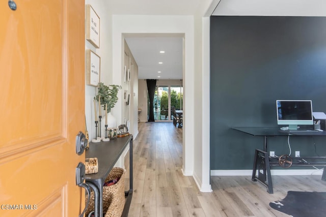 foyer entrance with light hardwood / wood-style flooring