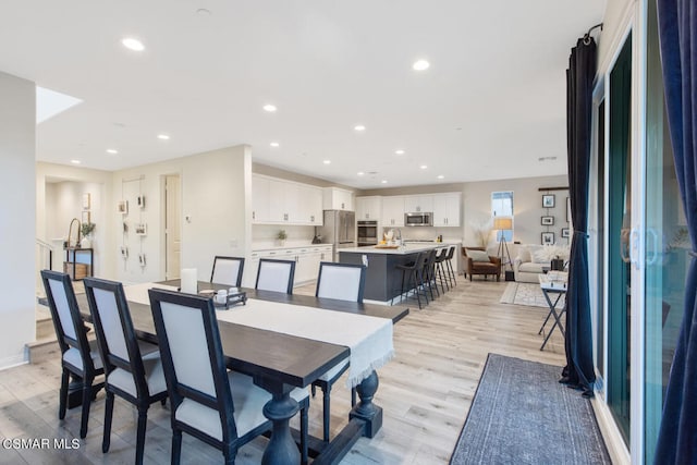 dining room featuring light wood-type flooring