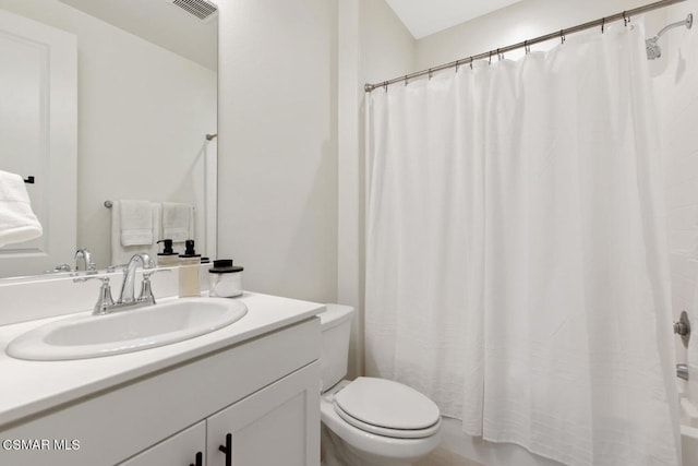 bathroom with toilet and vanity