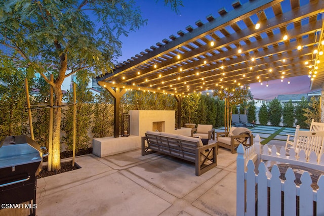 patio terrace at dusk with a pergola and an outdoor living space