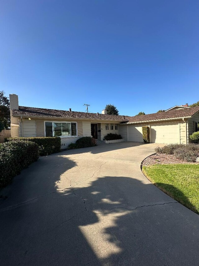 single story home with a garage