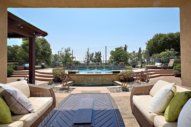 view of patio with pool water feature and an outdoor living space