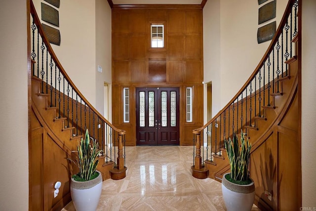 entryway featuring a high ceiling and a wealth of natural light