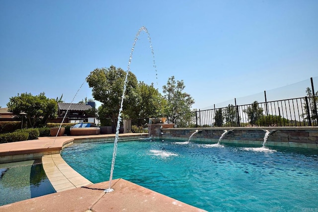 view of pool with pool water feature