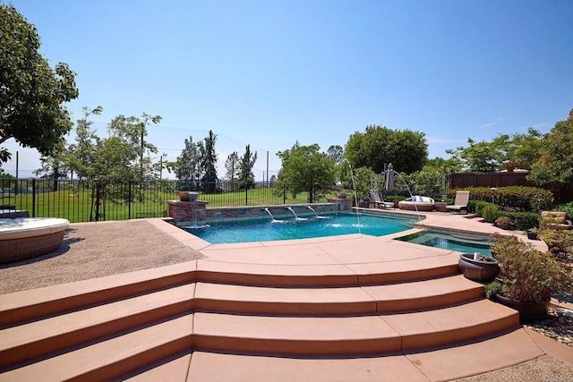 view of pool featuring a patio, an in ground hot tub, and pool water feature