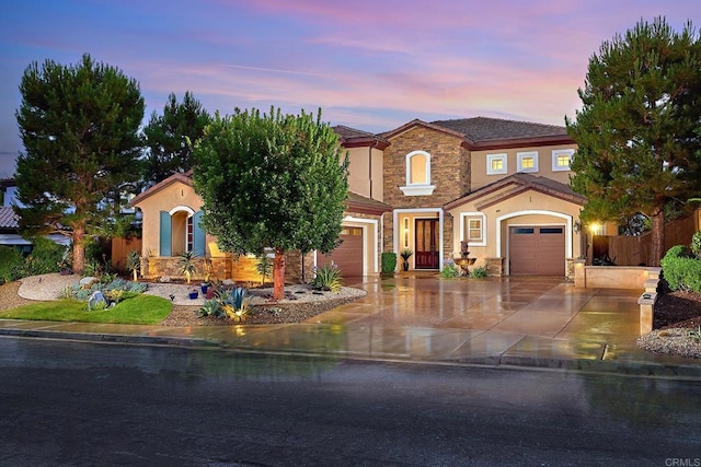 view of front of property with a garage