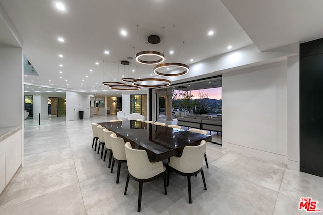 dining area featuring light tile patterned flooring