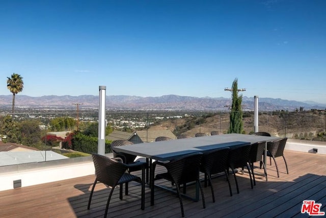 wooden deck featuring a mountain view