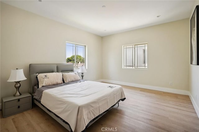 bedroom with light hardwood / wood-style floors