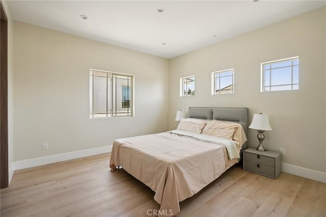 bedroom with light hardwood / wood-style flooring