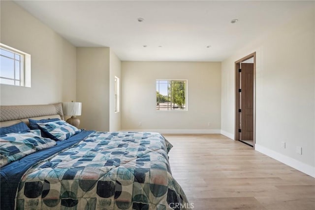 bedroom with light hardwood / wood-style flooring