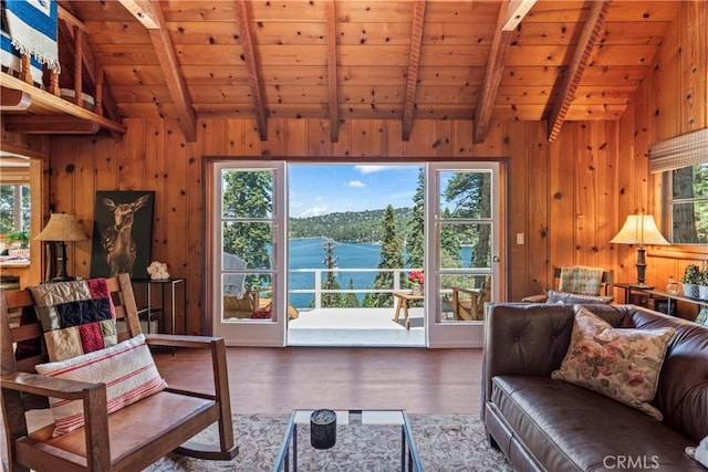 living room featuring hardwood / wood-style floors, lofted ceiling with beams, wooden walls, and wooden ceiling