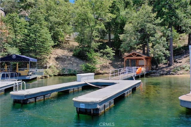 view of dock featuring a water view and a gazebo