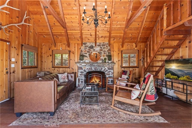 living room with a notable chandelier, wood ceiling, dark hardwood / wood-style floors, and lofted ceiling with beams