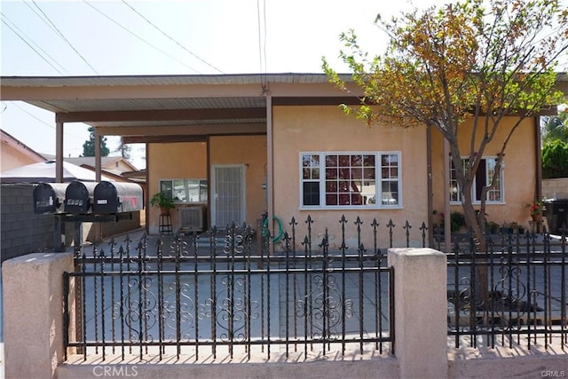 view of front of house with a carport