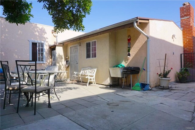 back of property with a patio