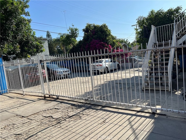 832 W 41st St, Los Angeles, CA 90037 - view of gate featuring fence and stairway