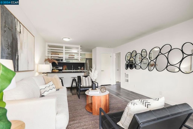 living room with dark hardwood / wood-style flooring