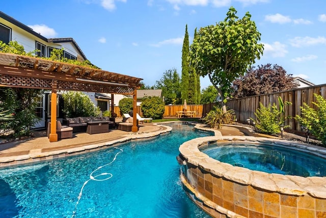 view of pool with an in ground hot tub, a patio area, and a pergola