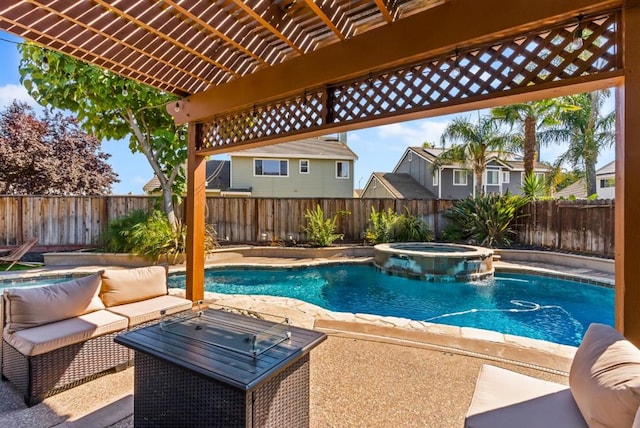 view of swimming pool with a patio area, pool water feature, and an in ground hot tub