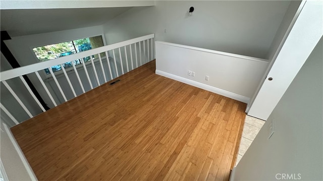 staircase with wood-type flooring