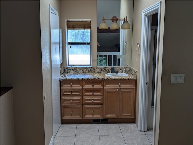 bathroom with tile patterned floors and vanity