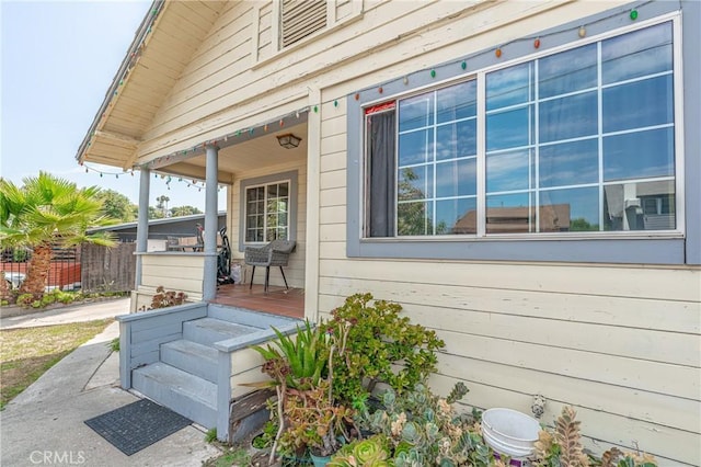 view of property exterior featuring covered porch