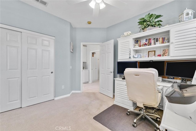 office featuring ceiling fan and light colored carpet