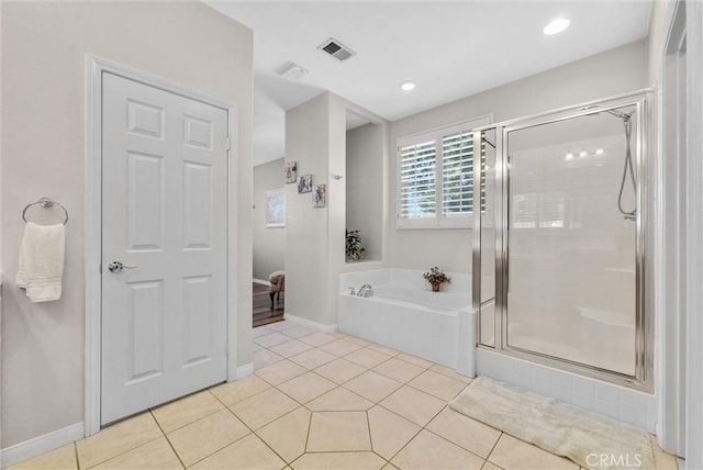 bathroom with tile patterned flooring and shower with separate bathtub