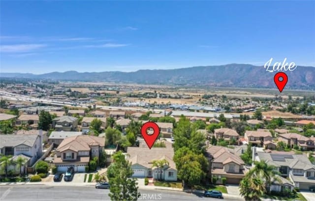 birds eye view of property with a mountain view