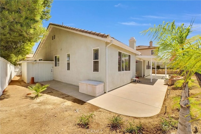 back of house featuring a patio